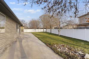View of fenced backyard