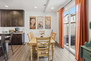 Dining space featuring light wood-style floors and recessed lighting