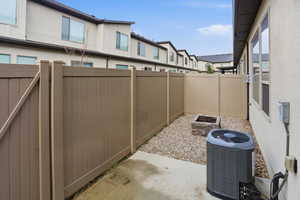 Fenced backyard featuring a patio