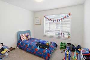 Bedroom with carpet and baseboards