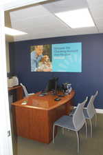 Office area with a paneled ceiling
