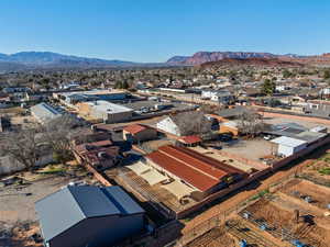 Aerial perspective of suburban area featuring a mountainous background