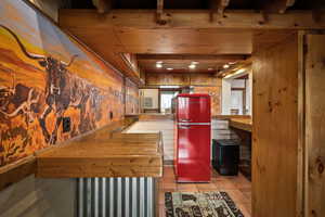 Interior space with light tile patterned flooring, recessed lighting, and electric panel