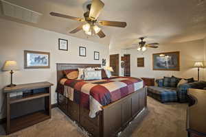 Carpeted bedroom with a ceiling fan and baseboards