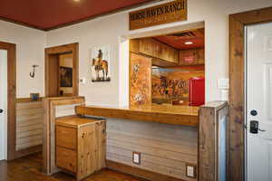 Bar with butcher block counters and fridge
