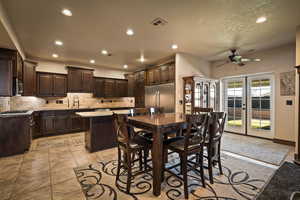 Dining space with recessed lighting, ceiling fan, and light tile patterned flooring