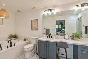 Bathroom with vanity, a bath, a shower stall, connected bathroom, and light tile patterned floors