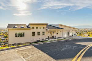 View of property with driveway and an attached garage