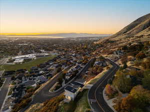 Aerial overview of property's location with nearby suburban area and a mountain backdrop