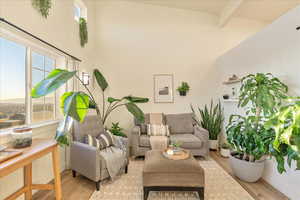 Living room featuring wood finished floors and plenty of natural light