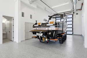 Garage featuring baseboards