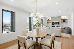 Dining space featuring light wood finished floors and recessed lighting