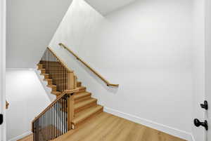 Staircase with wood finished floors