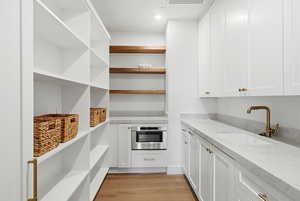 Storage area featuring a sink