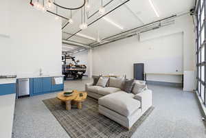 Living area featuring dark speckled floor