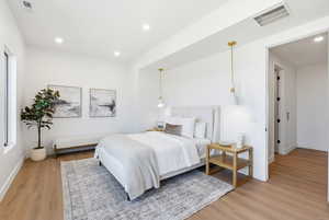 Bedroom featuring light wood-style floors and recessed lighting