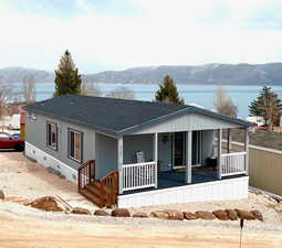 Young and clean 2 section home with lake backdrop.