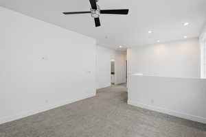 Unfurnished room with recessed lighting, light colored carpet, and a ceiling fan