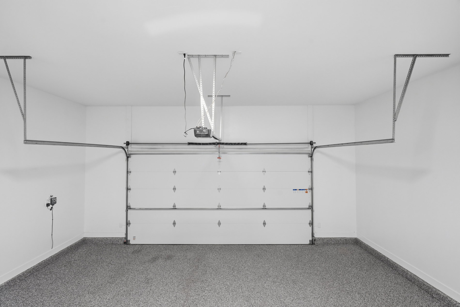 Garage featuring baseboards