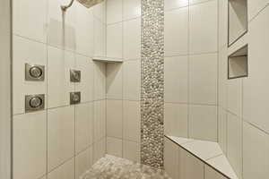 Full bath with a tile shower