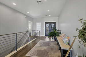 Entrance foyer featuring wood finished floors and recessed lighting