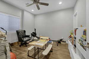 Home office with wood finished floors, recessed lighting, and ceiling fan