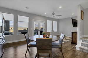 Dining space featuring french doors, wood-type flooring, recessed lighting, a mountain view, and ceiling fan