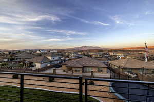 Balcony at dusk with a residential view