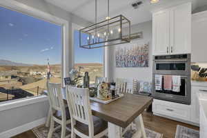 Dining area with dark wood finished floors