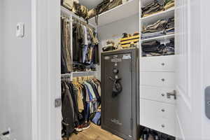 Spacious closet with light wood finished floors