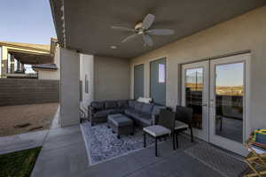 View of patio with french doors, ceiling fan, and an outdoor living space