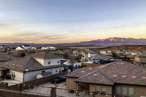 View of city featuring nearby suburban area and a mountainous background
