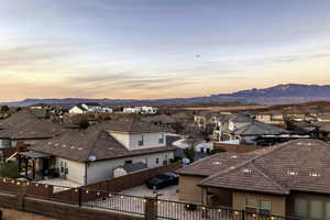 View of city with nearby suburban area and a mountainous background