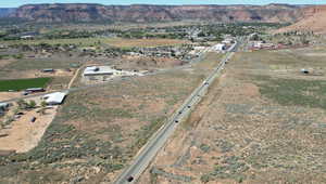 Aerial overview of property's location with mountains and rural landscape