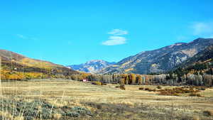 View of mountain backdrop with rural landscape