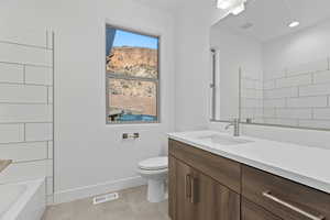 Bathroom featuring vanity and light tile patterned floors