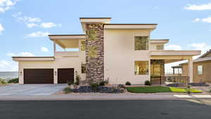 Contemporary home with stucco siding and driveway