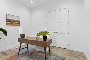 Home office featuring recessed lighting and light wood-style flooring