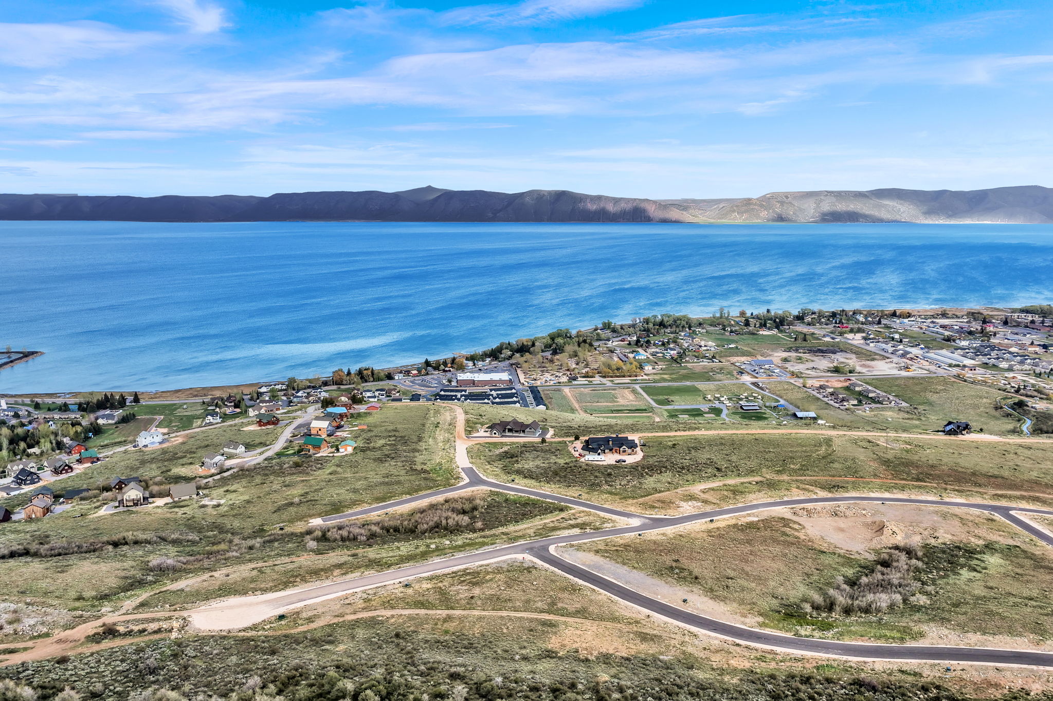 Expansive undeveloped land featuring paved roads and utilities