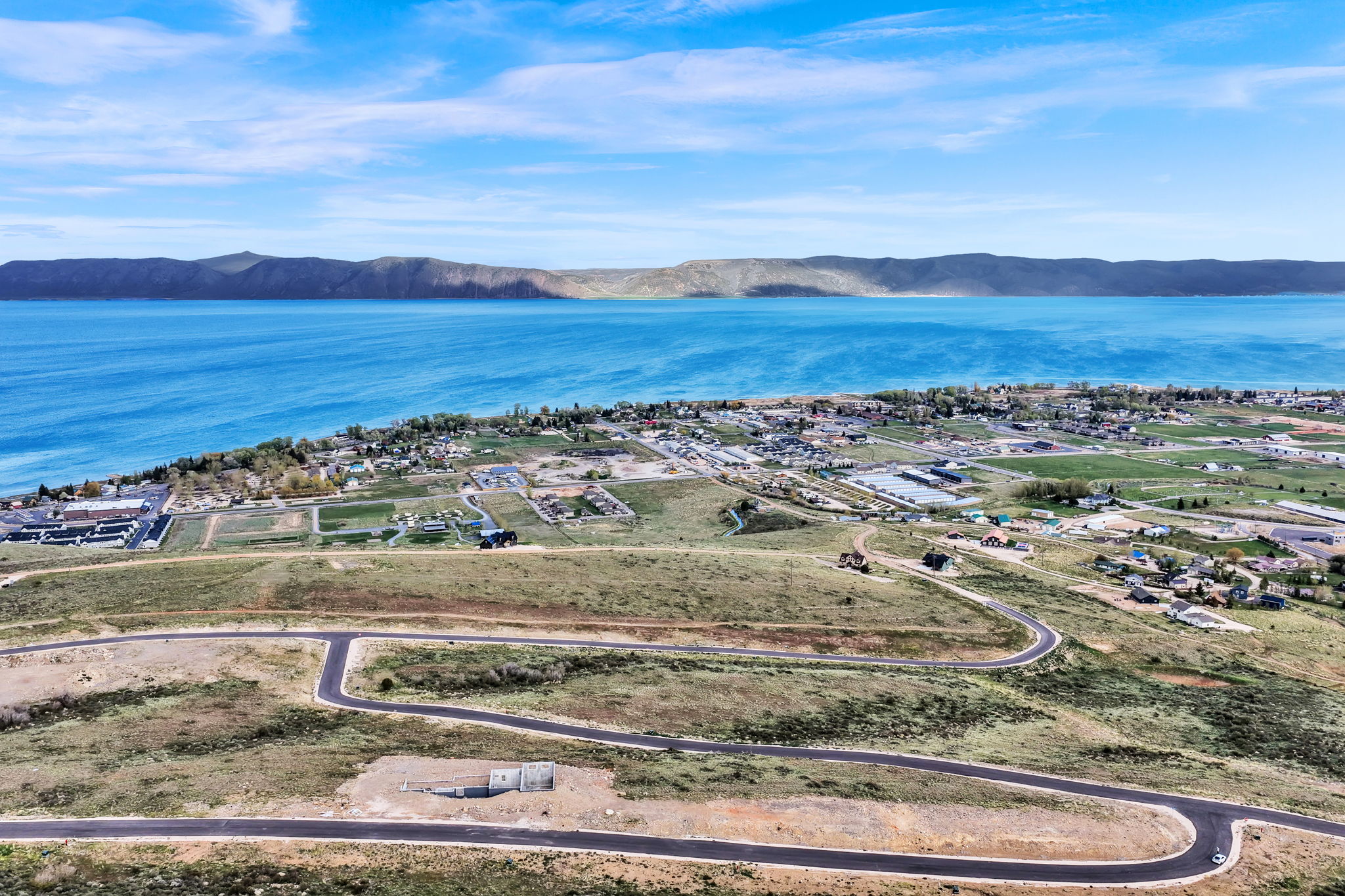 Expansive body of water with distant mountainous terrain