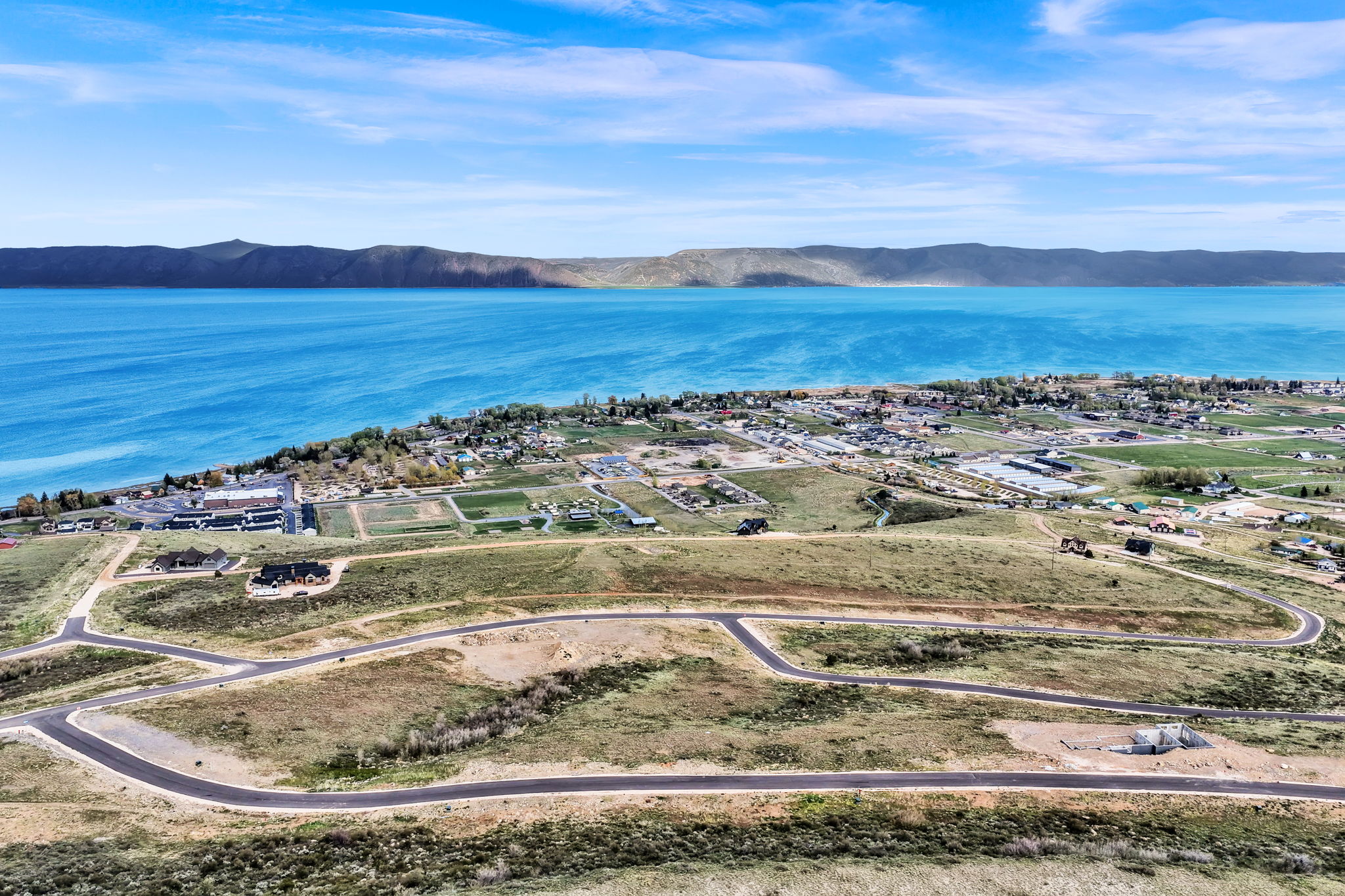 Elevated residential development with paved roads and building sites