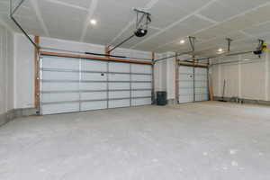 Garage featuring a garage door opener