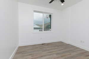 Spare room featuring light wood-style floors, recessed lighting, and ceiling fan