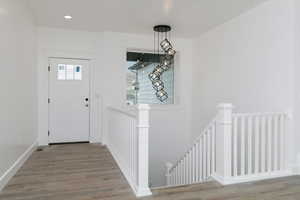 Entrance foyer featuring wood finished floors and recessed lighting