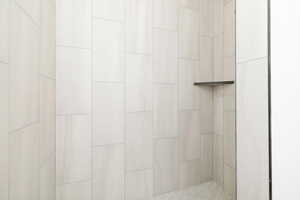 Bathroom view of a tile shower