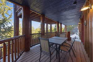 Wooden terrace featuring outdoor dining space
