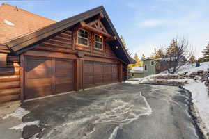 Garage with asphalt driveway