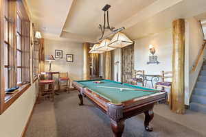 Recreation room with carpet and billiards