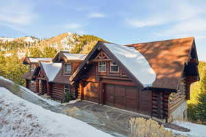 Log cabin featuring log exterior and a mountain view