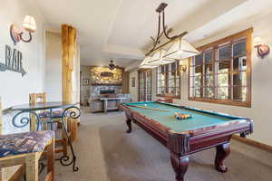 Playroom featuring a fireplace, a ceiling fan, and billiards table